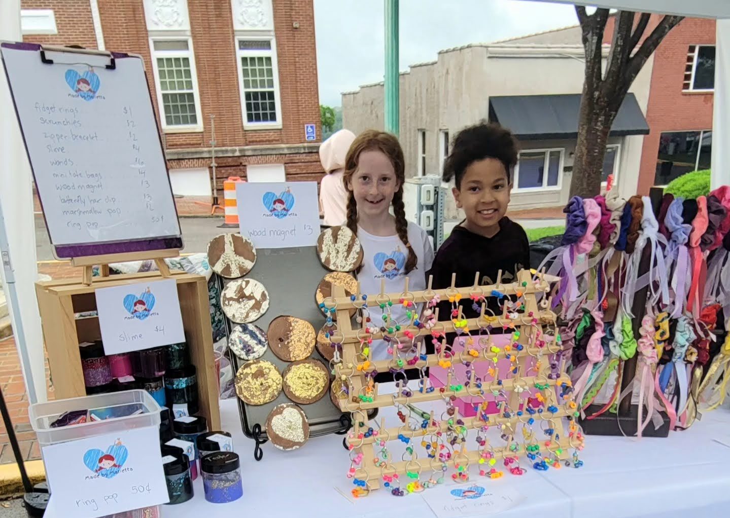 Made by Marietta During our market in Clarksville, TN we met up with Marietta, 7, who had a great booth that attracted a lot of attention with her wheel of discounts and prizes.