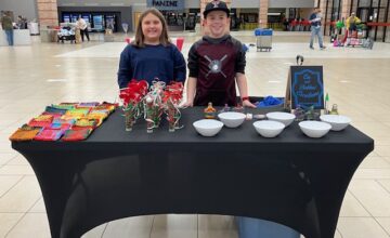 Landon (14) and Emerson (11) are the owners of Em and Bubba’s Creations! Their create-your-own sand art booth...